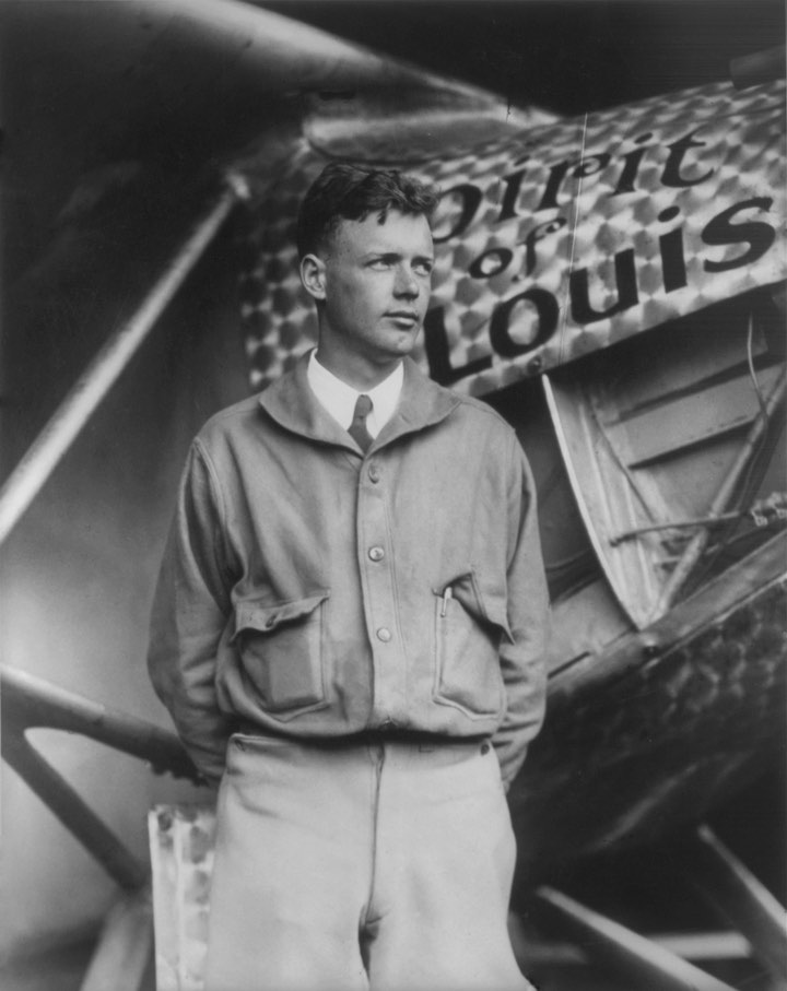 Charles Lindbergh posing in front of Spirit of St. Louis